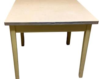 309 - Vtg Yellow Enamel Kitchen Table 31"x36"x36" (Description): Vintage kitchen table featuring a cream-colored laminate top with chrome edge banding and yellow painted wood base with tapered legs. The table displays charming mid-century styling with some wear consistent with age. Measures 31 inches by 36 inches by 36 inches.