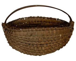 36 - Antique Woven Splint Basket w/ Handle (Description): Antique woven splint basket featuring a bent wood swing handle. The basket displays traditional craftsmanship with tightly woven splint construction in a round form. Measures 9" x 14" x 10".