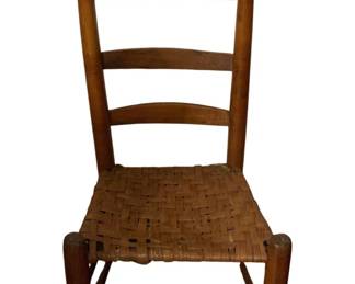 234 - Antique Ladderback Chair w/ Woven Splint Seat (Description): Antique ladderback chair featuring a three-slat back with turned acorn finials and a woven splint seat. The chair is constructed of warm-toned wood with turned legs connected by stretchers. Measures 34 inches high by 18.5 inches wide by 14 inches deep.