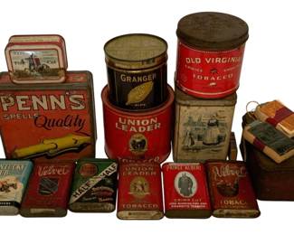 222 - Lot of Vintage Tobacco Tins (Description): A collection of vintage tobacco tins featuring various brands including Penn's Spells Quality, Union Leader, Granger, Old Virginia, Kentucky Club, Velvet, Half and Half, Lucky Strike, Prince Albert, and Repeater. The lot includes a variety of tin sizes and shapes, from small pocket tins to larger canister-style containers. Also included is a small leather-bound group of what appears to be miniature books or similar