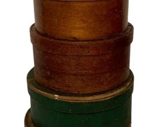 133 - 6 Antique Pantry Wood Boxes 26"x11" (Description): A collection of six wooden boxes in varying sizes and styles. The lot includes round bentwood pantry boxes in natural wood finishes, one painted green box, and a wooden firkin-style bucket with wire bail handle. The largest piece measures 26 inches by 11 inches.