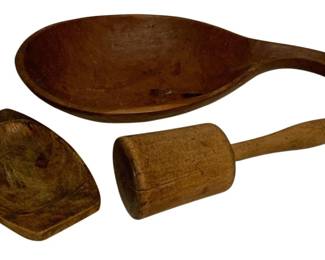 59 - 3 Primitive Wood Items (Description): A three piece lot of primitive wooden kitchen items including a large handled scoop or ladle with deep bowl, a wooden mallet, and a small carved wooden scoop or dish. All pieces display a warm patina consistent with age and use.