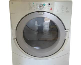 256 - Whirlpool Duet Front Load Washer 38"x27"x30" (Description): Whirlpool Duet front load washer in white. This unit features a large circular glass door with silver trim, multiple automatic and manual cycle options, and a control panel with rotary dial and push button selections. The washer sits on an integrated pedestal base. Measures 38 inches high by 27 inches wide by 30 inches deep. Shows signs of use with some surface soiling. Used as is electric/electronic/mechanical