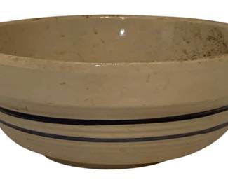 217 - Stoneware Mixing Bowl w/ Blue Stripes 4"x9" (Description): Vintage stoneware mixing bowl featuring classic blue banded stripes around the exterior. The bowl has a cream-colored glaze with a rolled rim edge, typical of traditional American country kitchen pottery. Measures 4 inches tall by 9 inches in diameter.
