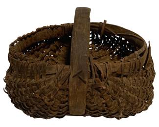 47 - Antique Woven Splint Buttocks Basket (Description): Antique hand-woven splint buttocks basket with a fixed bentwood handle. This rustic gathering basket features a traditional woven splint construction with a characteristic bulbous, kidney-shaped form. The basket shows a rich, aged brown patina consistent with age and use. Measures 5 inches by 9.5 inches by 9 inches.