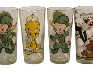 12 - 6 Pepsi Looney Tunes Character Glasses, 6" (Description): Collection of six Pepsi promotional Looney Tunes character glasses. The set features beloved Warner Bros. cartoon characters including Penelope Pussycat, Elmer Fudd (appearing twice in hunting attire), Tweety Bird, Sylvester the Cat with a butterfly net, and Pepe Le Pew. Each clear glass displays colorful character artwork with character names printed at the base. Glasses measure 6 inches tall.
