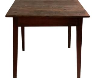 449 - Antique Wooden Farm Table 29"x28.25"x24" (Description): Antique wooden farm table featuring a rustic plank top with visible knots and natural wood grain patina. The table has a simple apron and rests on four tapered legs with a warm reddish-brown painted finish. The construction and styling suggest late19th to early 20th century craftsmanship. Measures 29 inches wide by 28.25 inches deep by 24 inches tall.