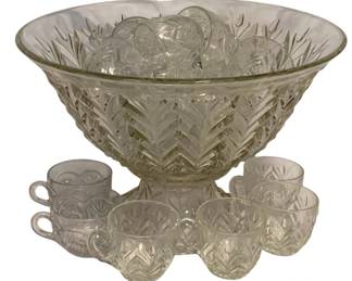 72 - 18pc Glass Punch Bowl Set w/ Cups (Description): An 18-piece glass punch bowl set featuring a large footed punch bowl with matching cups. The set displays a pressed glass design with a decorative feather or wheat pattern throughout. The punch bowl has a pedestal base and flared rim, accompanied by handled punch cups in the coordinating pattern. Clear pressed glass in a classic mid-century style, ideal for entertaining.