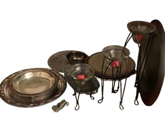 228 - Assorted Items (Description): An assorted lot of decorative serving and home accent items including silverplate serving plates and bowls with ornate rims, a pressed glass serving platter, two wrought iron candle stands with glass dish inserts, a small decorative lantern, and a vintage can opener. The silverplate pieces feature traditional scalloped and gadrooned edge designs.