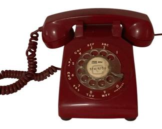475 - Vtg Red ITT Rotary Dial Telephone 5"x9"x5" (Description): Vintage red ITT rotary dial telephone in a classic mid-century design. This desk phone features a traditional rotary dial with alphanumeric characters, coiled handset cord, and matching red receiver. The dial center displays an area code 804 and phone number. Measures 5" x 9" x 5". Used as is electric/electronic/mechanical item. No guarantee all components, untested.