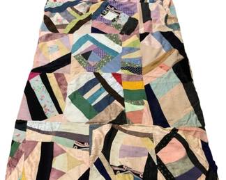 523 - Vtg Patchwork Crazy Quilt Top Unfinished (Description): Vintage patchwork crazy quilt blanket, unfinished. This quilt top features an eclectic mix of colorful fabric pieces in various patterns including florals, polka dots, stripes, and solid colors arranged in an asymmetrical crazy quilt style. Shows signs of age and use with some staining and wear consistent with a well-loved antique textile. Measures 80" x 128".