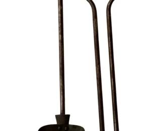 115 - 2 Fireplace Items 25" (Description): Two-piece fireplace tool set measuring 25 inches. The set includes a shovel with decorative pierced design and a pair of tongs, both with ball finial handles.