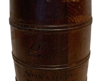 82 - Vtg Briggs Smoking Tobacco Wood Barrel (Description): The barrel displays the Briggs Smoking Tobacco logo and includes the company's slogan "When A Feller Needs A Friend" embossed on the front. The piece has a rich, warm brown patina with visible wood grain throughout. Measures 7 1/2" x 5.25".