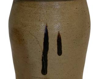 41 - Ant. Stoneware Crock w/ Cobalt Decoration-AS IS (Description): Antique stoneware crock featuring cobalt blue slip decoration on the front. The crock has a salt-glazed exterior with a tan/gray body and brown-glazed interior rim. The piece shows age-appropriate wear including a visible crack. Measures 11.5 inches tall by 7.5 inches in diameter.