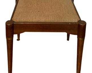 148 - Vtg Stool/Bench 14"x16.5"x18.5" (Description): Vintage stool or bench featuring a woven fabric top and tapered wooden legs with brass accent bands. Measures 14 inches by 16.5 inches by 18.5 inches.