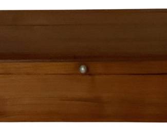 482 - Wooden Storage Box w/ Dovetail Joints (Description): Wooden storage box featuring dovetail joint construction and a small metal knob closure. The box has a warm honey-toned finish with a hinged lid. Measures 3.25" x 10" x 6.5".