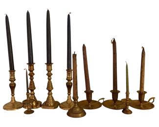 112 - Lot of Assorted Brass Candleholders (Description): A lot of assorted brass candleholders in various styles and sizes. The collection includes traditional turned candlesticks and chamberstick designs with finger loops, offering versatile options for display and entertaining.