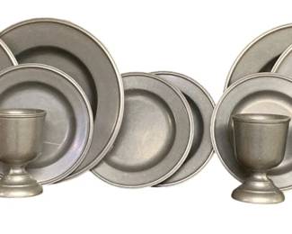 300 - 12pcs Pewter Plates and Goblets (Description): The set includes plates in various sizes and footed goblets or egg cups with traditional turned bases. The pieces display the characteristic matte gray finish of quality pewter with simple, classic styling suitable for both display and use.
