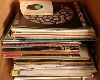 233 - Lot of Vintage LP Vinyl Records (Description): A collection of vintage LP vinyl records featuring a variety of albums. The lot includes assorted genres and appears to contain several dozen records in their original sleeves. Notable among the visible albums is a Christmas compilation. Records show varying degrees of wear consistent with age and use.
