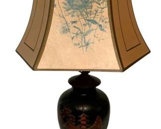 157 - Japanese Lacquer Pagoda Scene Table Lamp (Description): Japanese-style table lamp featuring a black lacquer vase base with hand-painted pagoda and landscape scene in red and gold tones. The vase rests on an ornate bronze-finished pedestal base. Topped with a hexagonal bell shade decorated with blue botanical chrysanthemum prints on cream panels with olive green borders. Measures 28.5 inches tall. Used as is electric/electronic/mechanical
