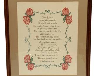 63 - Framed Psalm 23 Cross Stitch Needlepoint (Description): Framed needlepoint featuring Psalm 23:1-4 rendered in cross stitch. The devotional text is surrounded by a decorative border of pink roses and green scrolling vines. Presented with a tan mat in a wooden frame. Measures 19.5" x 15.5".