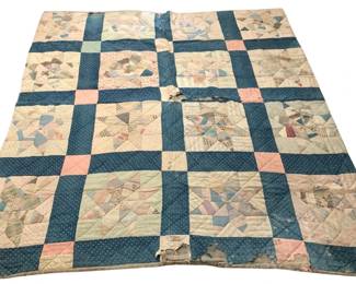 522 - Vtg Patchwork Star Quilt Blue Pink 84"x74.5" (Description): Vintage handmade patchwork quilt featuring a star pattern design. The quilt displays a variety of fabrics in shades of blue, pink, cream, and muted pastels, set against a navy blue polka dot sashing. The pieced blocks showcase an assortment of calico prints, stripes, plaids, and solid fabrics typical of early to mid-20th century quilting. The quilt shows age-related wear including holes and fraying along the edges. Measures 84