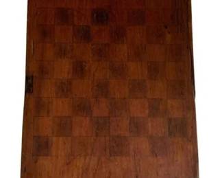 236 - Antique Wooden Checkerboard 26"x13.5" (Description): Antique checkerboard crafted from wood with an inlaid checkered playing surface in alternating light and dark wood tones. The board features a rustic, well-worn patina consistent with age and use, with a raised edge or lip along the top. Shows character marks, scratches, and wear throughout, adding to its primitive charm. Measures 26" x 13.5".