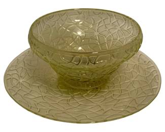 57 - 2pc. Hess Bowl & Plate Set 6"x12" (Description): Two-piece Hess bowl and plate set in pale yellow-green pressed glass featuring an intricate geometric crackle pattern design. The matching set includes a footed bowl and coordinating underplate. Measures 6" x 12".