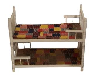 491 - White Painted Wooden Bunk Bed for Dolls (Description): 22"x26"x13" - Doll size wooden bunk bed painted white with turned spindle posts and finials. The bunk bed features colorful patchwork quilted mattresses in shades of red, yellow, navy, brown, and orange. This classic doll bed shows wear consistent with age and play. Measures 22 inches by 26 inches by 13 inches.