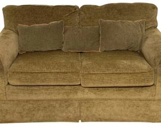 243 - Olive Green Chenille Love Seat w/3 Pillows (Description): Comfortable love seat upholstered in olive green chenille fabric with rolled arms and a skirted base. Includes three matching accent pillows with contrasting piping. Traditional style with plush cushioning. Measures 35 inches high by 62 inches wide by 39 inches deep.