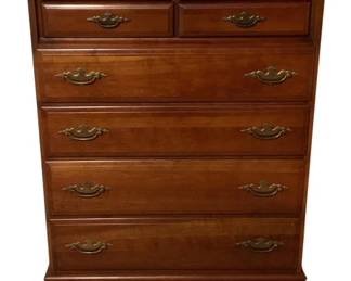 456 - Colonial Style Maple 6-Drawer Dresser (Description): Colonial style six-drawer dresser crafted in warm maple wood with a rich honey finish. Features two small drawers at the top above four graduated full-width drawers, all fitted with decorative brass bail pull hardware in a traditional Chippendale style. The dresser rests on bracket feet with a scalloped apron. Measures 43 inches high by 34 inches wide by 18 inches deep.