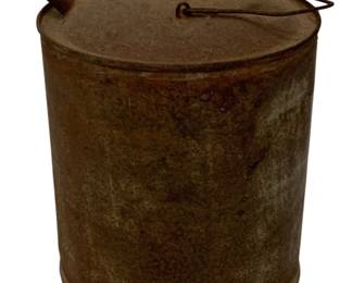 195 - Vtg Metal Oil Can w/ Wire Handle 8.5"x6.5" (Description): The can features a threaded top opening and shows a weathered, rustic patina throughout. Measures 8.5" x 6.5".