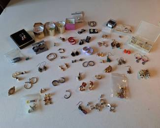Variety of pierced, clip on and screw back earrings. some singles