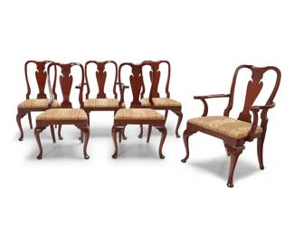 1156 A set of six Queen Anne style dining chairs 20th century Likely Hickory Chair Company, comprising two armchairs and four side chairs, each with fiddle back and seat upholstered in cotton blend fabric, raised on front pad feet 6 pieces Each side chair: 38.5" H x 22.5" W x 23" D; Each armchair: 38.5" H x 27" W x 23" D Estimate: $150 - $250