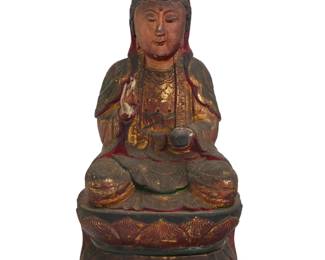 1289 A Chinese polychrome carved wood figure of Guanyin 19th century Depicted seated on a double lotus base, with right hand in shunya mudra, parcel-gilt and painted, with inset glass accent to forehead 15.875" H x 8" W x 6.75" D Estimate: $100 - $200