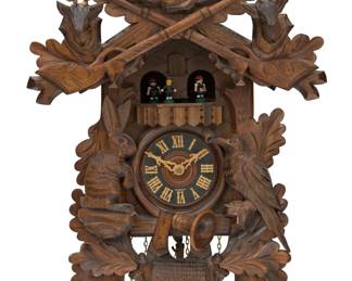 1103 A Black Forest musical cuckoo clock Late 20th century With applied label numbered: 3883; movement impressed with various numbers and: REGULA / MADE IN GERMANY The wall-mounted clock with pinecone weights, Roman numeral dial, and Swiss Romance (Reuge) musical movement playing "Der Fröhliche Wanderer" and "Edelweiss," the upper portion with articulated figures and cuckoo Case overall: 22.5" H x 15" W x 10.5" D approximately Estimate: $300 - $500