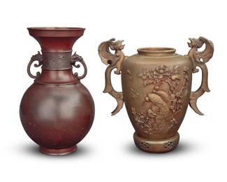 1351 Two Japanese metal vases 20th century Comprising one patinated copper with beast mask handles, and one brass with phoenix handles, depicting avian motifs in relief to body above an openwork base 2 pieces Taller: 14" H x 8.5" Dia.; Shorter: 13.25" H x 13" W x 8.5" D Estimate: $300 - $500
