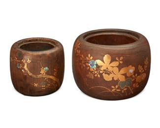 1347 Two Japanese hibachis Late Meiji Era (1868-1912) Each stamped with faint characters to underside The carved wood hibachis with copper lining, each adorned with inlaid mother of pearl and gilt-painted decorations, comprising one larger with floral motifs and one smaller with floral and avian motifs 2 pieces Larger: 7.75" H x 11" Dia.; Smaller: 6.375" H x 7.5" Dia. Estimate: $200 - $400