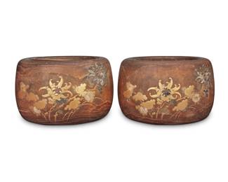 1346 A pair of Japanese hibachis 20th century Each decorated with silver overlay, mother-of-pearl inlay, and carved, painted, and gilt floral elements in relief, each with metal liner 2 pieces Each: 8.25" H x 13.5" Dia. Estimate: $400 - $600
