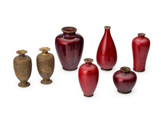 1338 A group of seven East Asian diminutive bud vases 20th century One signed by Hayakawa Komejiro; others variously marked Comprising five red enamel vases and two bronze vases, each depicting a village scene and birds in relief 7 pieces Tallest: 4.875" H x 2.25" Dia.; Shortest: 2.375" H x 2.25" Dia. Estimate: $200 - $400
