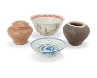 1339 An assembled group of East Asian pottery items 20th century Comprising a Chinese blue and white footed dish, a small rice bowl, a glazed lidded jar, and a small open jar 4 pieces Bowl: 2.125" H x 4.625" Dia.; Dish: 3.625" Dia.; Lidded: 2.625" H x 3" Dia. Estimate: $200 - $300