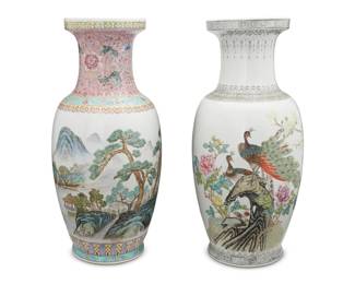 1290 Four Chinese Famille Rose porcelain vases 20th century Three with Jingdezhen marks; one bearing an apocryphal reign mark for Jiaqing Period (1796-1820); each bearing Chinese inscriptions to side Comprising one depicting a forested mountain landscape on a white ground with a pink neck, two decorated with the Eight Immortals on a white ground with pink necks, and one depicting peacocks and flowers and a white ground 4 pieces Largest: 18.5" H x .25" Dia.; Smaller pair: 14.25" H x 7" Dia. Estimate: $300 - $500
