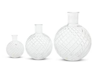 1007 Three Baccarat glass 'Cyclades' vases Late 20th century Each with etched factory mark In graduated sizes, the largest and smallest with factory boxes 3 pieces Largest: 9.875" H x 7.75" Dia.; Smallest: 4.875" H x 3.875" Dia.; Box: 12.75" H x 10" W x 10" D Estimate: $500 - $800
