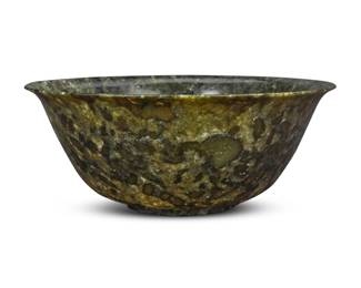 1307 A Chinese carved hardstone bowl 20th century Housed in a custom fitted case Bowl: 4" H x 10.125" Dia.; Case: 9.375" H x 12.25" W x 12.25" D Estimate: $200 - $400