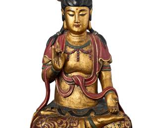 1288 An Asian carved giltwood figure of the Buddha 20th century Polychrome decorated, depicted seated with hands in karana mudra 20" H x 11.75" W x 9.5" D Estimate: $400 - $600