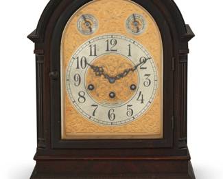 1129 A Seth Thomas bracket clock Early 20th century Marked to dial: SETH THOMAS; marked to movement: Seth Thomas / THOMASTON, CONN. / 113 A / MADE IN / ST [within a circle and diamond cartouche] / U.S.A. The three-movement clock with Westminster chimes, the silvered dial with Roman numeral hours and Slow/Fast and Chime/Silent switches, housed in a wood case with glazed front 14" H x 11" W x 8" D Estimate: $300 - $500