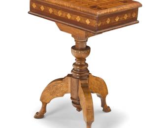 1187 A Continental parquetry fruitwood teapoy 20th century, possibly Italian With geometric motifs to top and diamonds to sides, opening to reveal a partitioned interior, raised on a tripod pedestal support carved with floral motifs 25.75" H x 18.25" W x 12.25" D Estimate: $500 - $700