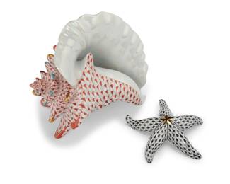 1012 A Herend porcelain fishnet conch shell and starfish Late 20th century Each with blue printed factory mark; shell numbered: 224 / 6555-0-00/VH / ED; starfish numbered and inscribed: 265 / 1ST EDITION / 15533/VHNM / E96 2 pieces Shell: 4.75" H x 7.25" W x 6.75" D; Starfish: 1.125" H x 4.5" W x 4.25" D Estimate: $400 - $600