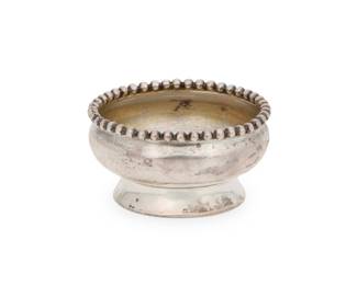 1006 A Tiffany sterling silver salt cellar Late 19th century With impressed factory marks and: 4374 / STERLING / 3199 / L [directorship of Charles L. Tiffany (1892-1902)] With beaded rim 1.25" H x 2.25" Dia. 1.2 oz. troy approximately Estimate: $100 - $200