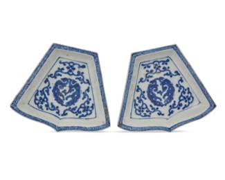 1291 A pair of Chinese blue and white porcelain sweet meat dishes Qing Dynasty (1644-1912) or later Of trapezoidal form, decorated with beasts and scrolled motifs 2 pieces Each: 1" H x 5.375" W x 4.5" D Estimate: $300 - $400